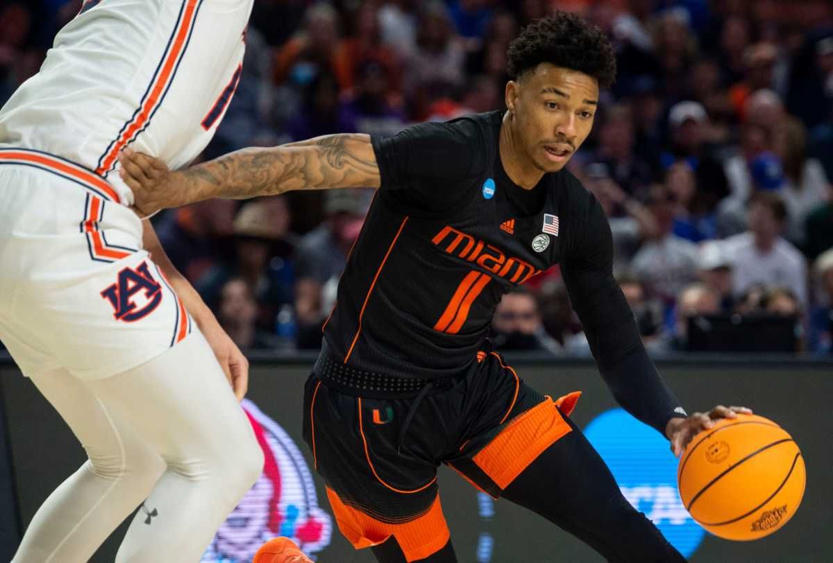 Miami Hurricanes guard Jordan Miller (11) drives the ball during the second round of the 2022 NCAA tournament at Bon Secours Wellness Arena in Greenville, S.C., on Sunday, March 20, 2022. Miami Hurricanes lead Auburn Tigers 33-32 at halftime.