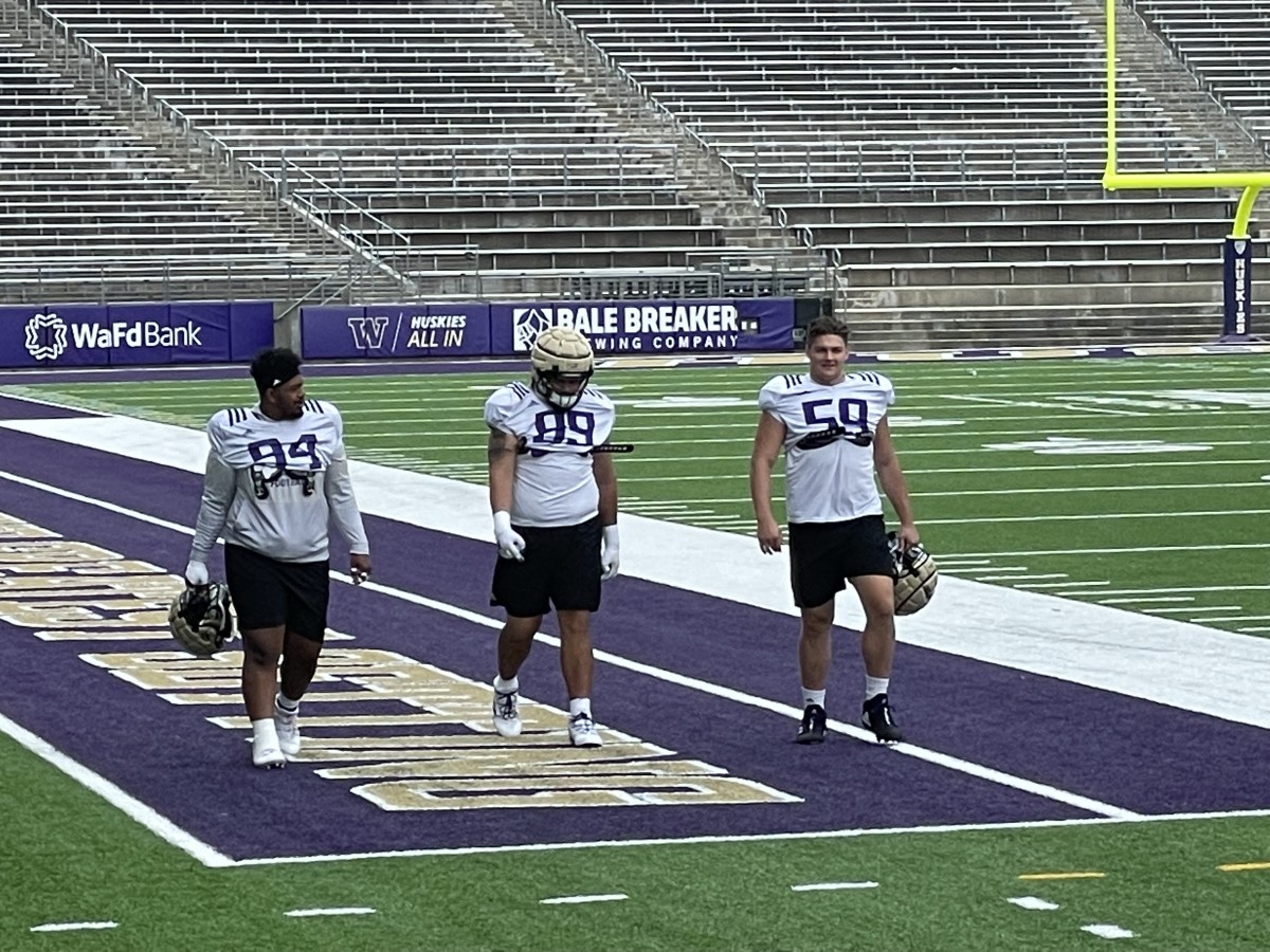 Draco Bynum (59) heads to practice with Faatui Tuitele (99) and the departed Taki Taimani (94).