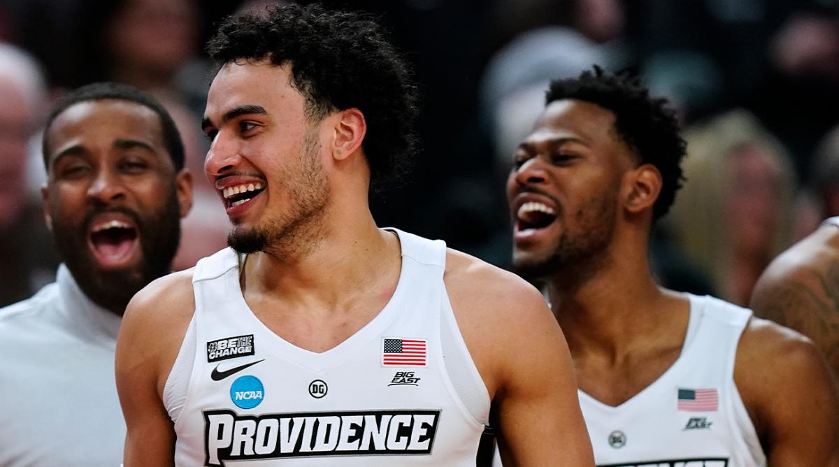 Providence forward Justin Minaya (15) celebrates with teammates in the last minute of a college basketball game against Richmond in the second round of the NCAA men’s tournament Saturday, March 19, 2022, in Buffalo, N.Y.