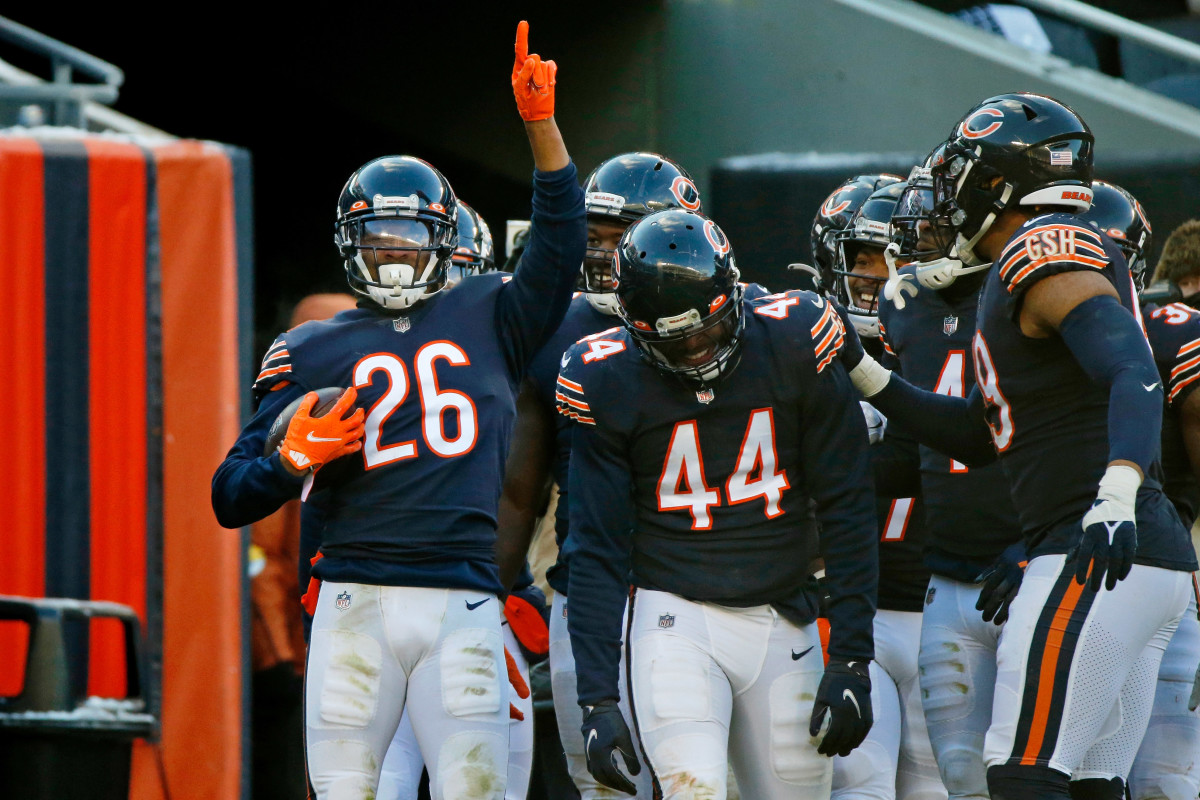 Jan 2, 2022; Chicago, Illinois, USA; Chicago Bears safety Deon Bush (26) celebrates after making an interception against the New York Giants during the second half at Soldier Field. Mandatory Credit: Jon Durr-USA TODAY Sports