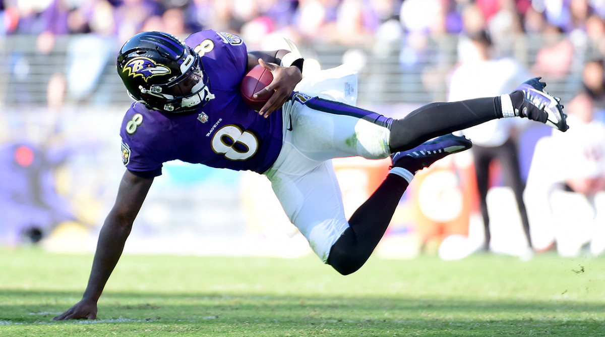 Baltimore Ravens quarterback Lamar Jackson (8) falls while being tackled in the fourth quarter against the Cincinnati Bengals.