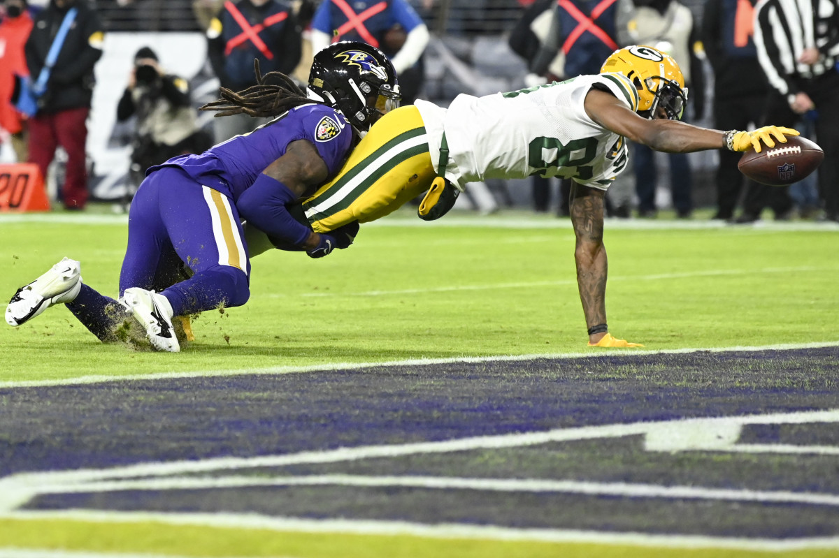 Dec 19, 2021; Baltimore, Maryland, USA; Green Bay Packers wide receiver Marquez Valdes-Scantling (83)] divers for a touchdown during the second half \HG\ at M&T Bank Stadium. Mandatory Credit: Tommy Gilligan-USA TODAY Sports