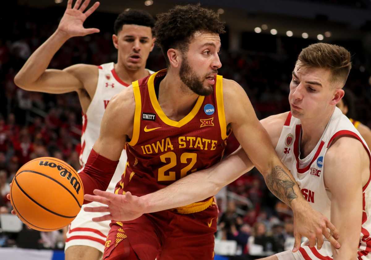 Iowa State Cyclones guard Gabe Kalscheur (22) drives to the basket while Wisconsin Badgers forward Tyler Wahl (5) guards him during the second half of their game in the 2022 NCAA Division I Men's Basketball Tournament Sunday, March 20, 2022, at Fiserv Forum in Milwaukee. Iowa State defeated Wisconsin 54-49.
