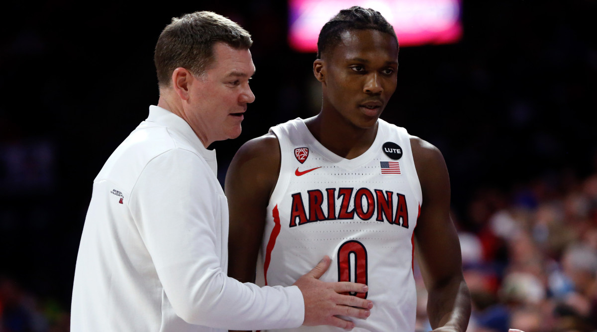 Arizona Wildcats head coach Tommy Lloyd talks with guard Bennedict Mathurin (0) during the first half against the UCLA Bruins at McKale Center.