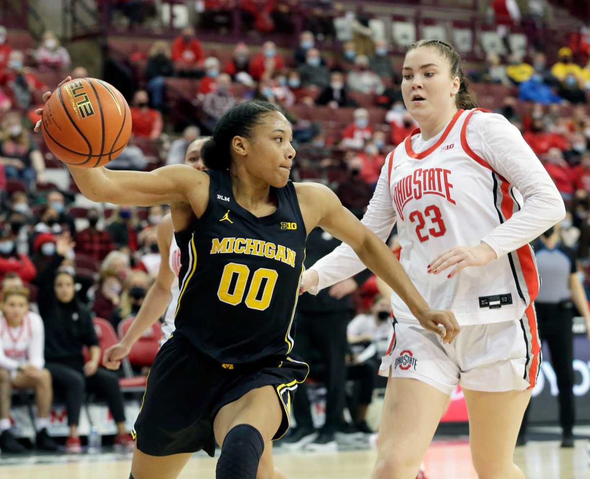 Naz Hillmon dribbles the ball past an Ohio State defender.