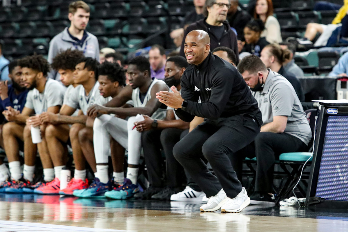 Saint Peter’s coach Shaheen Holloway claps