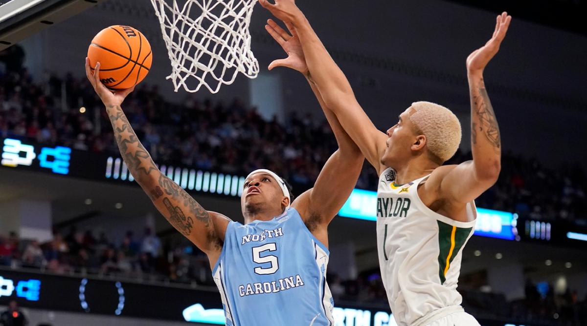 North Carolina forward Armando Bacot (5) goes up for a shot as Baylor forward Jeremy Sochan (1) defends in the first half of a second-round game in the NCAA college basketball tournament in Fort Worth, Texas, Saturday, March, 19, 2022.