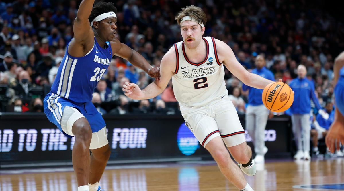 Gonzaga forward Drew Timme (2) drives around Memphis center Malcolm Dandridge (23) during the second half of a second-round NCAA college basketball tournament game, Saturday, March 19, 2022, in Portland, Ore.
