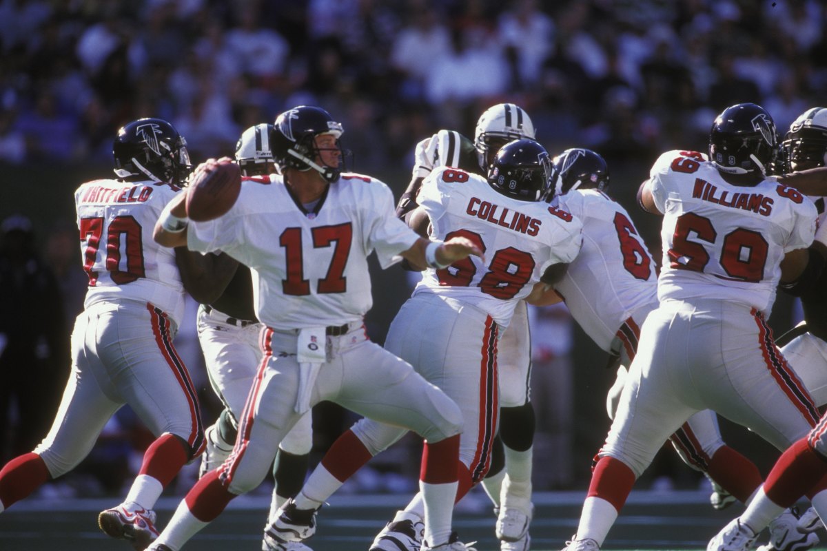 DeBerg throwing a pass during his record-setting start.