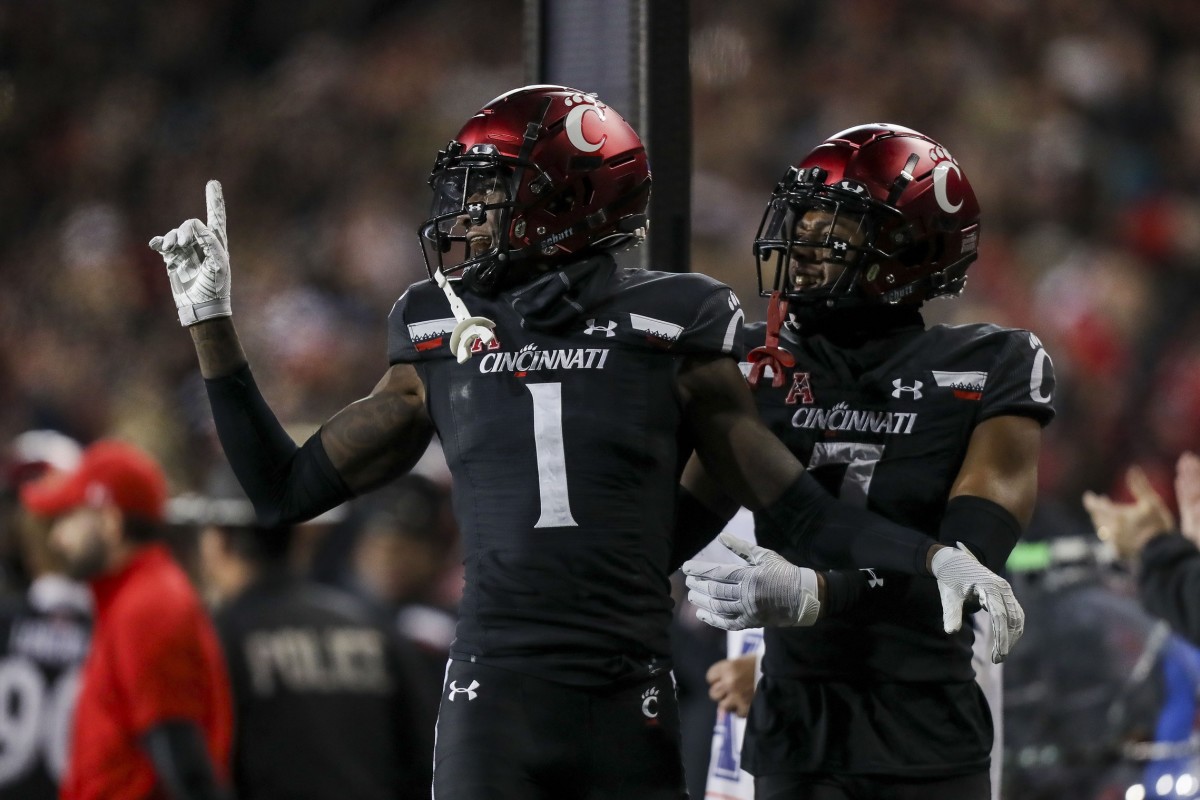 Nov 20, 2021; Cincinnati, Ohio, USA; Cincinnati Bearcats cornerback Ahmad Gardner (1) and cornerback Coby Bryant (7) react after cornerback Arquon Bush (not pictured) blocked a field goal by the Southern Methodist Mustangs in the second half at Nippert Stadium. Mandatory Credit: Katie Stratman-USA TODAY Sports