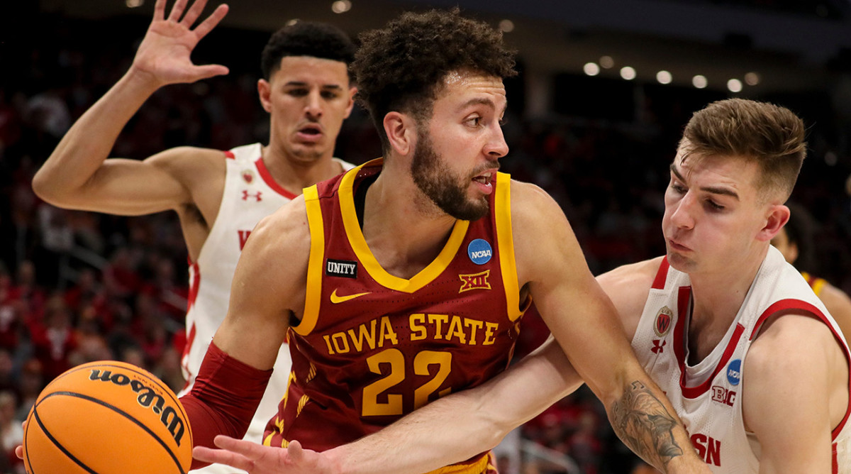 Iowa State Cyclones guard Gabe Kalscheur (22) drives to the basket while Wisconsin Badgers forward Tyler Wahl (5) guards him during the second half of their game in the 2022 men's NCAA tournament.