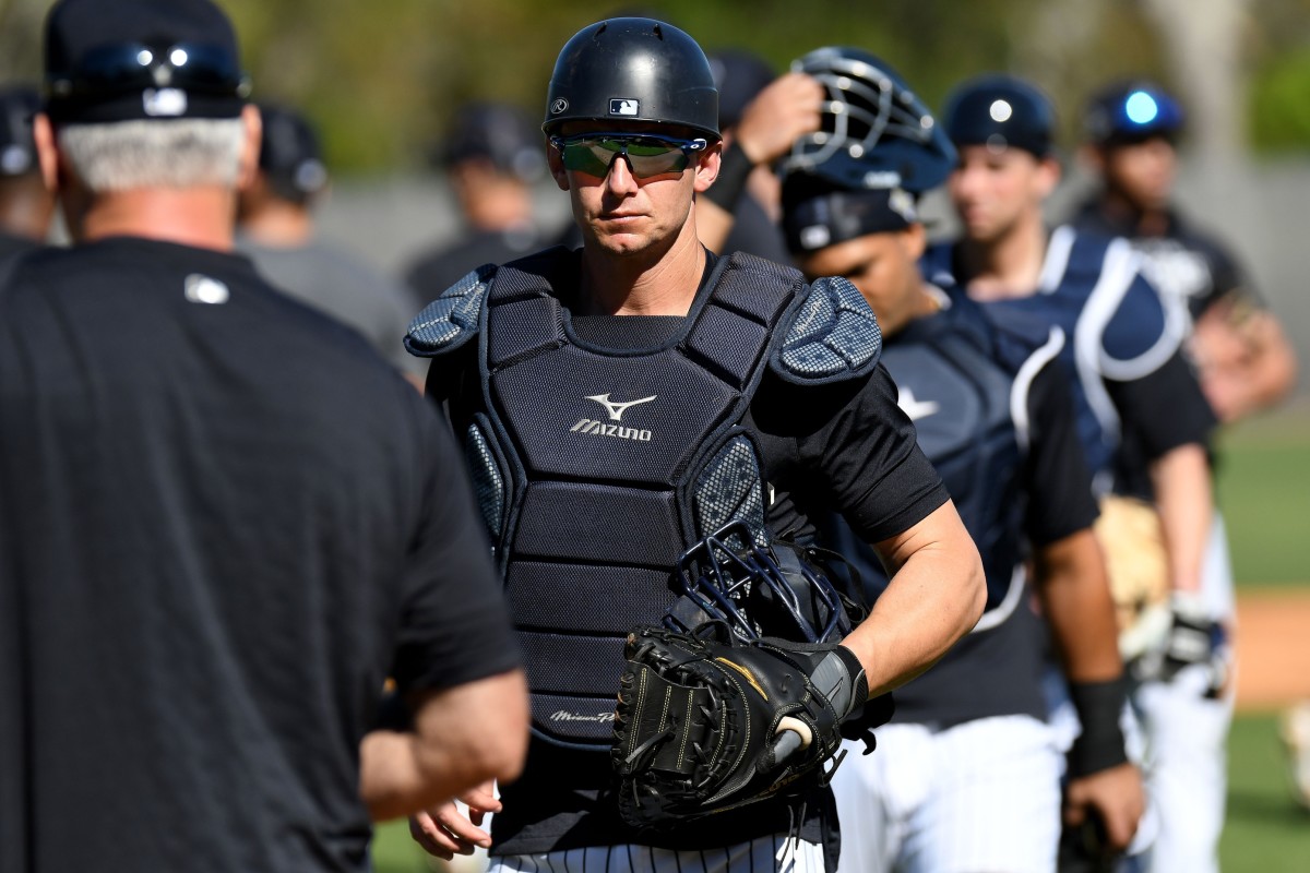Yankees catcher Rob Brantly participating in catching drills at spring training