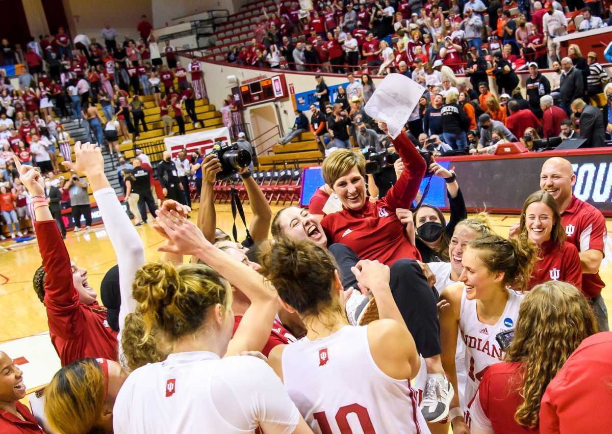 The Indiana women's basketball team picks up Coach Teri Moren after the win over Princeton.