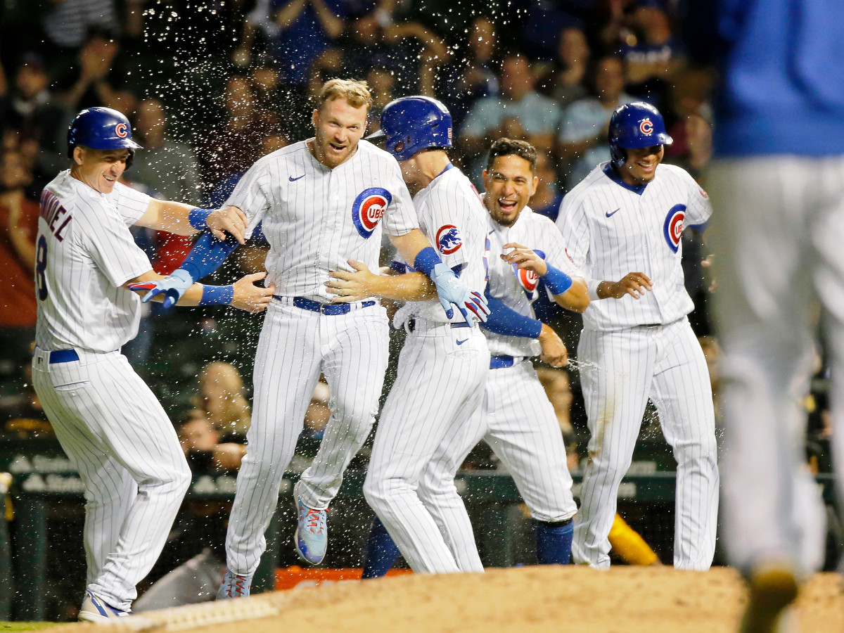 Sep 2, 2021; Chicago, Illinois, USA; (Editors Notes: Caption Correction) Chicago Cubs left fielder Ian Happ (8) celebrates with teammates after their win over the Pittsburgh Pirates at Wrigley Field. The Chicago Cubs won 6-5 in eleven innings.