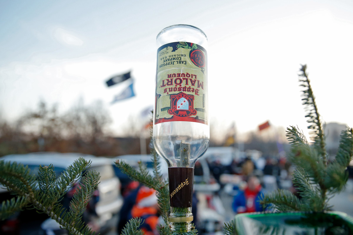 Dec 20, 2021; Chicago, Illinois, USA; A Christmas tree topped with an empty bottle of Malort stands in the parking lot as fans tailgate before the game between the Chicago Bears and Minnesota Vikings at Soldier Field. Mandatory Credit: Jon Durr-USA TODAY Sports