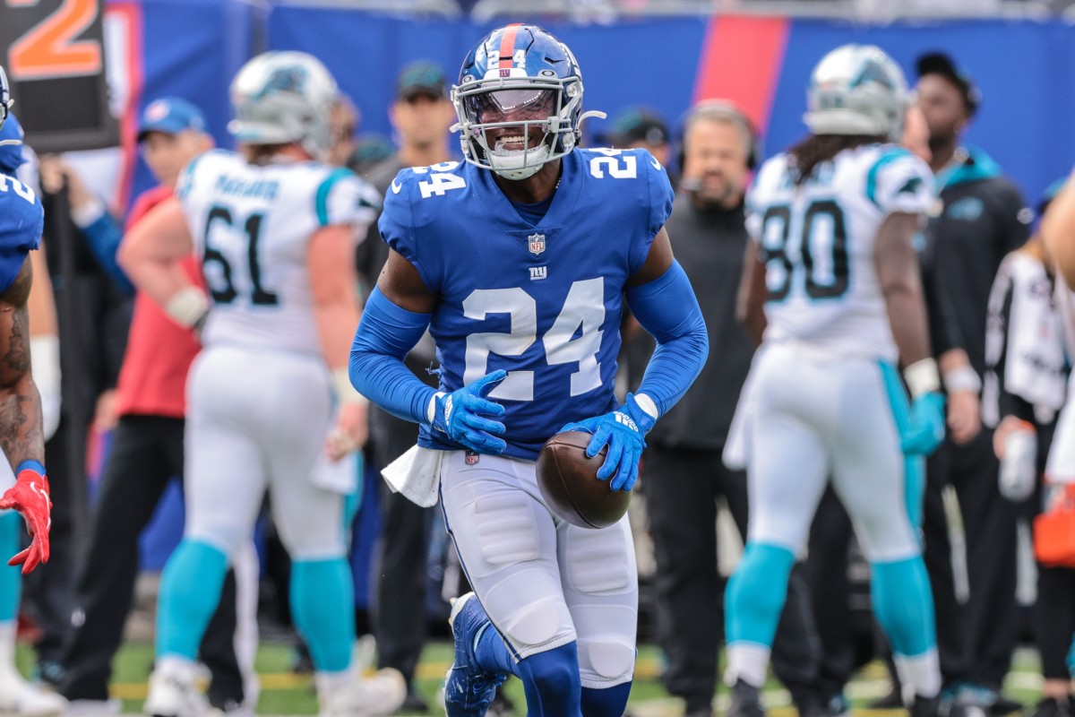 Oct 24, 2021; East Rutherford, New Jersey, USA; New York Giants cornerback James Bradberry (24) reacts after an interception against the Carolina Panthers during the first half at MetLife Stadium.