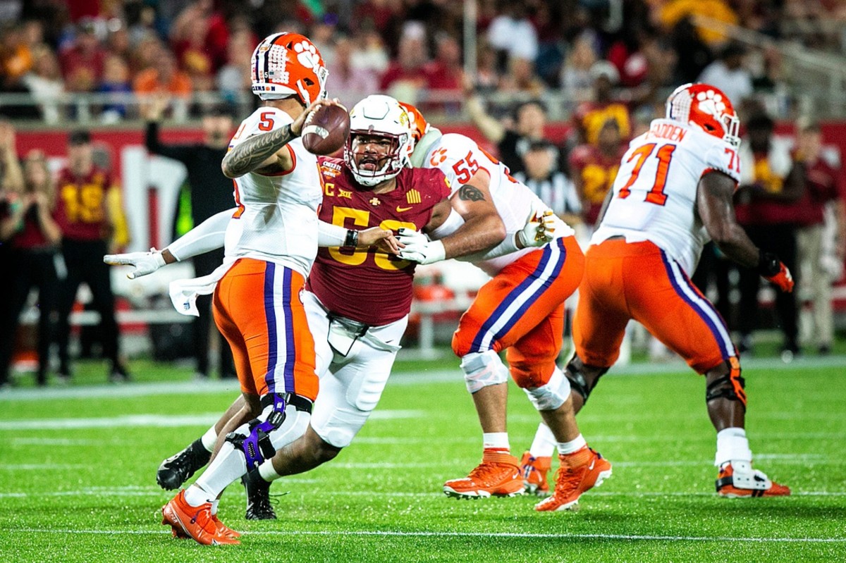 Iowa State defensive end Eyioma Uwazurike (58) pressures Clemson quarterback DJ Uiagalelei (5) during a NCAA college football game in the Cheez-It Bowl, Wednesday, Dec. 29, 2021, at Camping World Stadium in Orlando, Fla. 211228 Cheez It Bowl Extras 020 Jpg