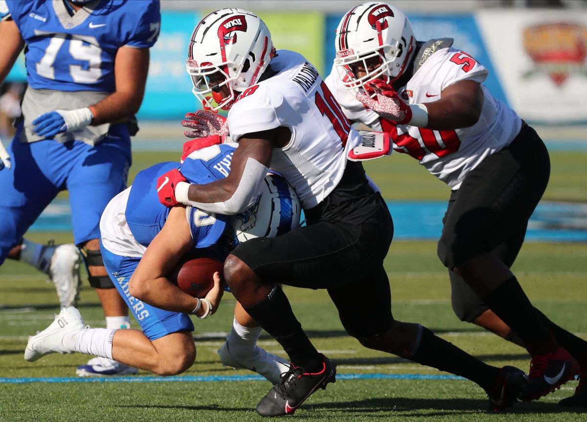 MTSU quarterback Asher O'Hara (10) gets sacked by Western defensive end DeAngelo Malone (10) and Western defensive tackle Ricky Barber (50) on Saturday, Oct. 3, 2020, at MTSU. 5 Mtsu V Western Football