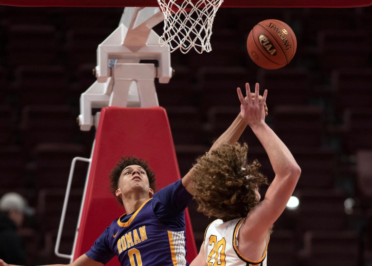 Roman Catholic senior Daniel Skillings jumps to block Archbishop Wood junior Carson Howard at Giant Center in Hershey on Saturday, March 26, 2022. Archbishop Wood boys basketball fell to Roman Catholic in PIAA championship final in class 6A, 77-65.