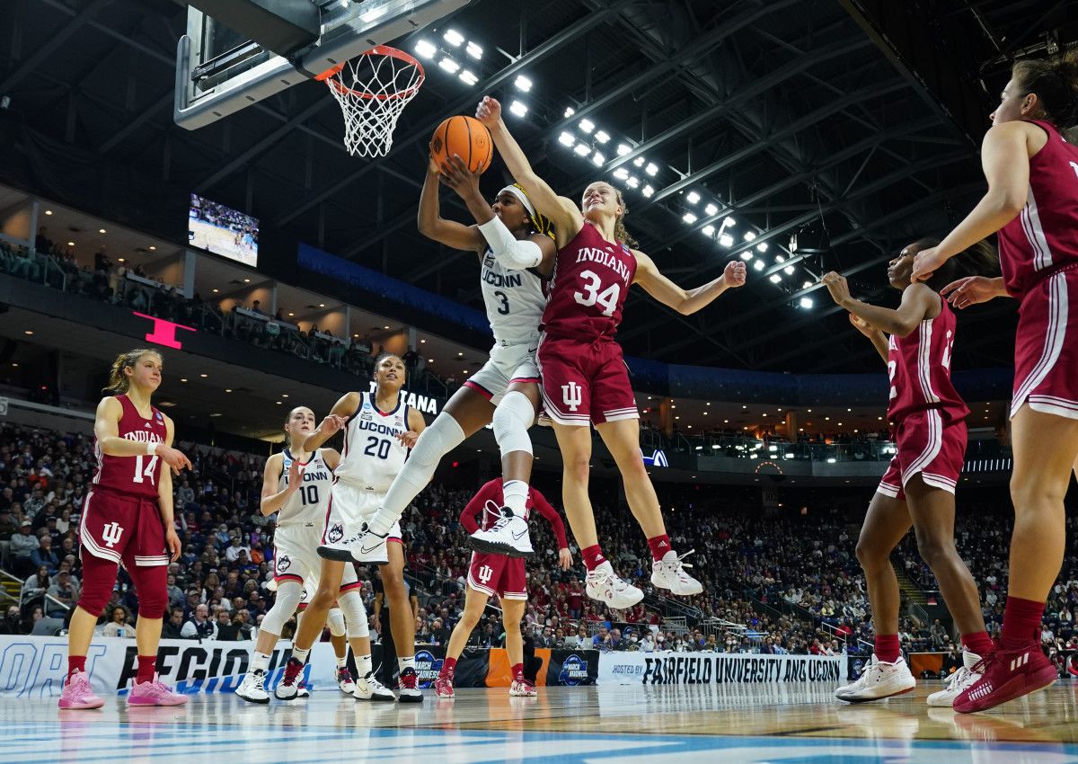 Indiana's Grace Berger tries to block the ball in the Hoosiers' Sweet 16 matchup versus UConn.