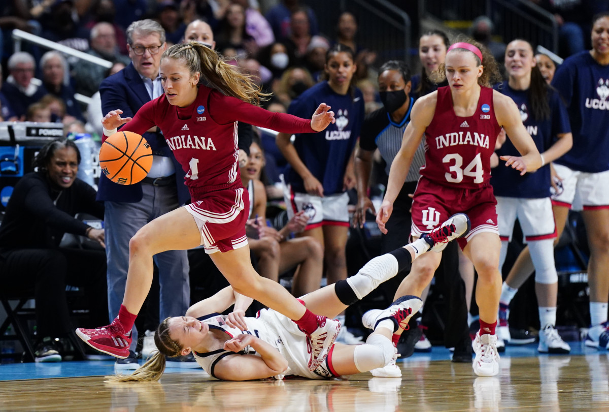 Nicole Cardaño-Hillary dribbles over a UConn defender.