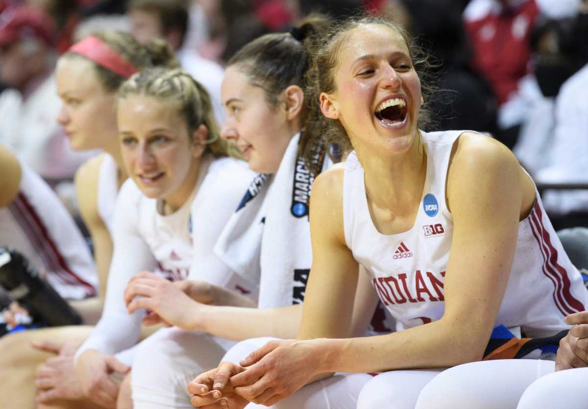 Ali Patberg laughs on the bench.