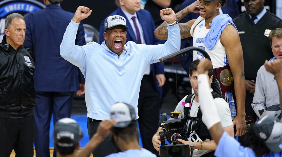 North Carolina head coach Hubert Davis celebrates after North Carolina won a college basketball game against St. Peter’s in the Elite 8 round of the NCAA tournament, Sunday, March 27, 2022, in Philadelphia.