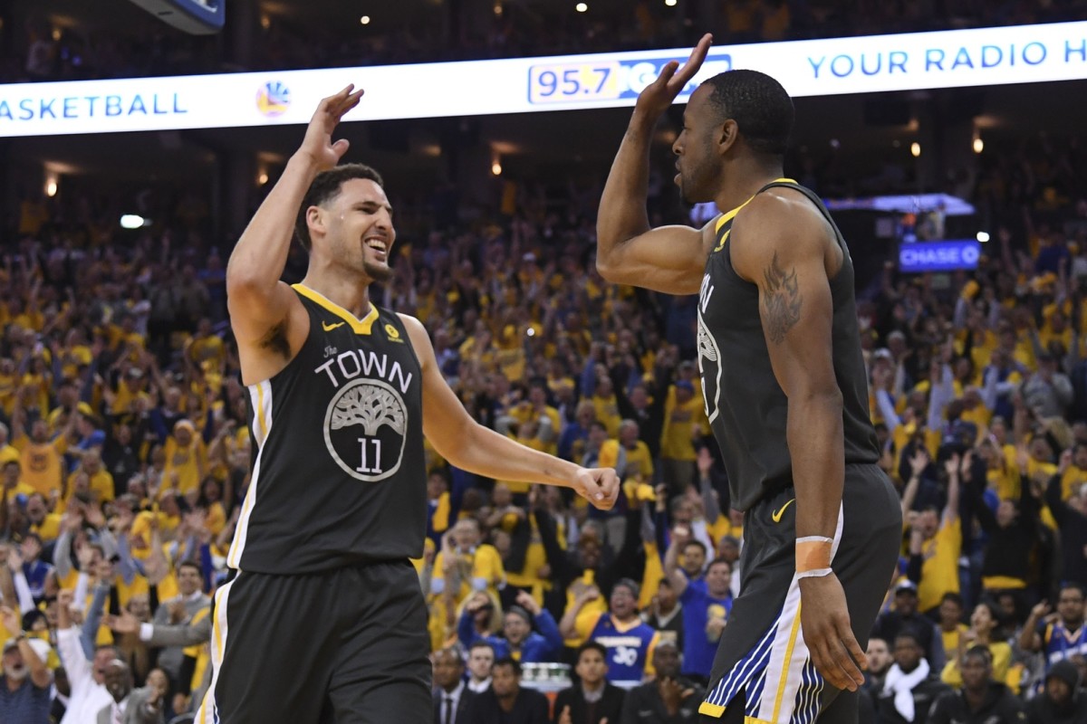 May 1, 2018; Oakland, CA, USA; Golden State Warriors guard Klay Thompson (11) celebrates with forward Andre Iguodala (9) against the New Orleans Pelicans during the fourth quarter in game two of the second round of the 2018 NBA Playoffs at Oracle Arena. The Warriors defeated the Pelicans 121-116. Mandatory Credit: Kyle Terada-USA TODAY Sports