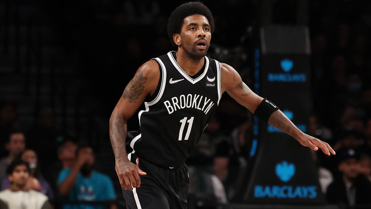 Brooklyn Nets guard Kyrie Irving (11) looks on against the Charlotte Hornets during the first quarter at Barclays Center.