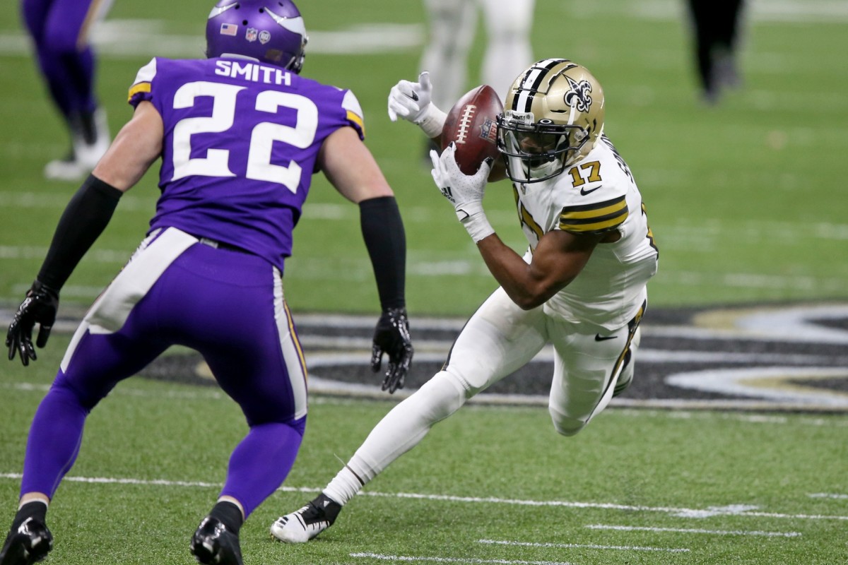 Dec 25, 2020; New Orleans Saints receiver Emmanuel Sanders (17) makes a catch in front of Minnesota Vikings safety Harrison Smith (22). Mandatory Credit: Chuck Cook-USA TODAY Sports
