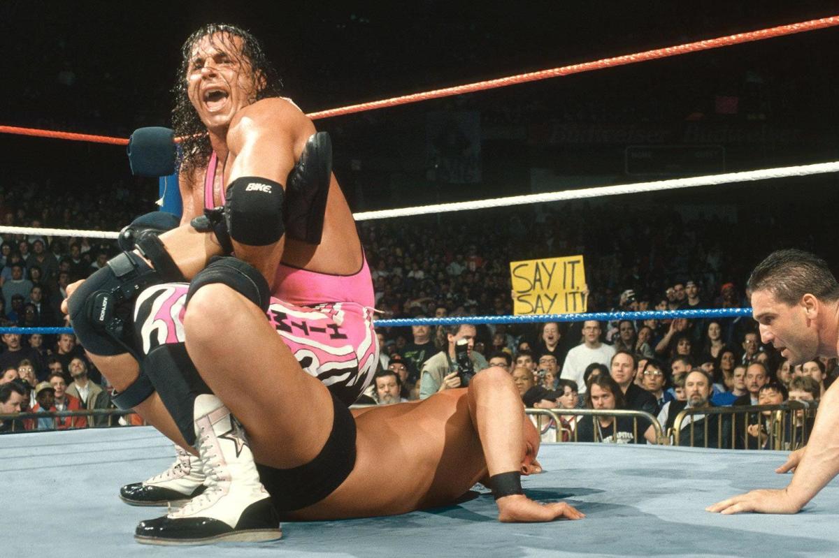 Bret Hart puts Steve Austin in the Sharpshooter