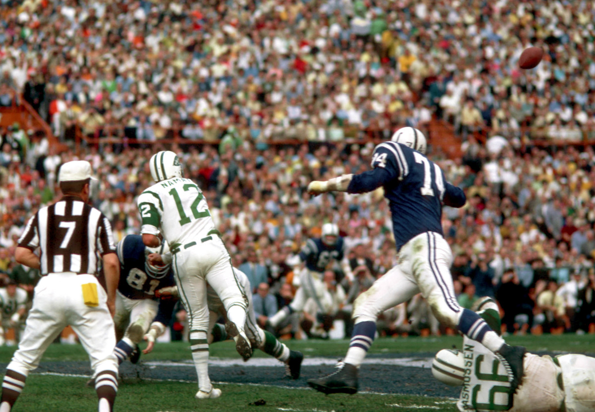 New York Jets quarterback #12 Joe Namath lets go on a pass down field during Super Bowl III against the Baltimore colts at the Orange Bowl. The Jets defeated the Colts 16-7.