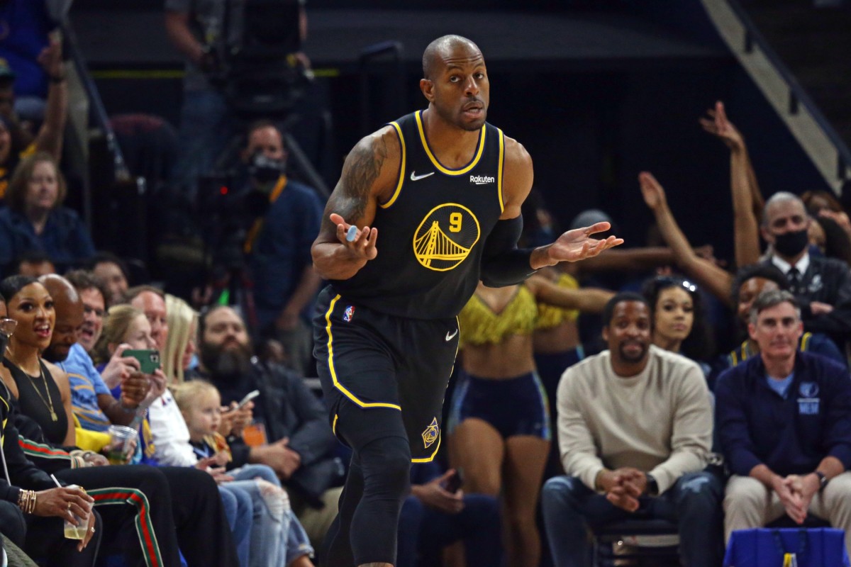 Mar 28, 2022; Memphis, Tennessee, USA; Golden State Warriors guard-forward Andre Iguodala (9) reacts as Memphis Grizzlies fans boo after a three point basket during the first half against the Memphis Grizzlies at FedExForum. Mandatory Credit: Petre Thomas-USA TODAY Sports