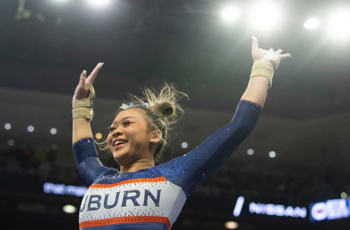 Auburn's Suni Lee reacts after her vault performance as Auburn Tigers gymnastics takes on Florida Gators at Neville Arena in Auburn, Ala., on Saturday, March 5, 2022. Auburn Tigers and Florida Gators ended in a tie at 198.575.