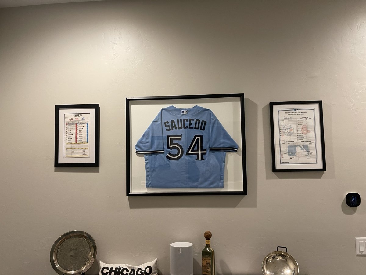 Saucedo's framed jersey sits in his family's home office in Tuscon, Az., as a testament to his perseverance. 
