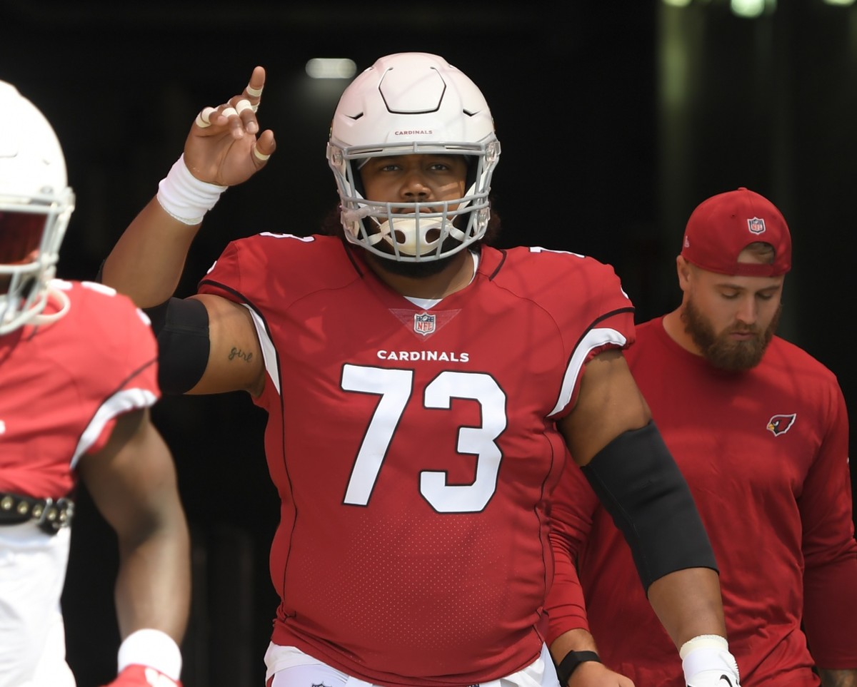 Sep 12, 2021; Nashville, Tennessee, USA; Arizona Cardinals offensive guard Max Garcia (73) points to the sky as he takes the field against the Tennessee Titansbefore the game at Nissan Stadium.