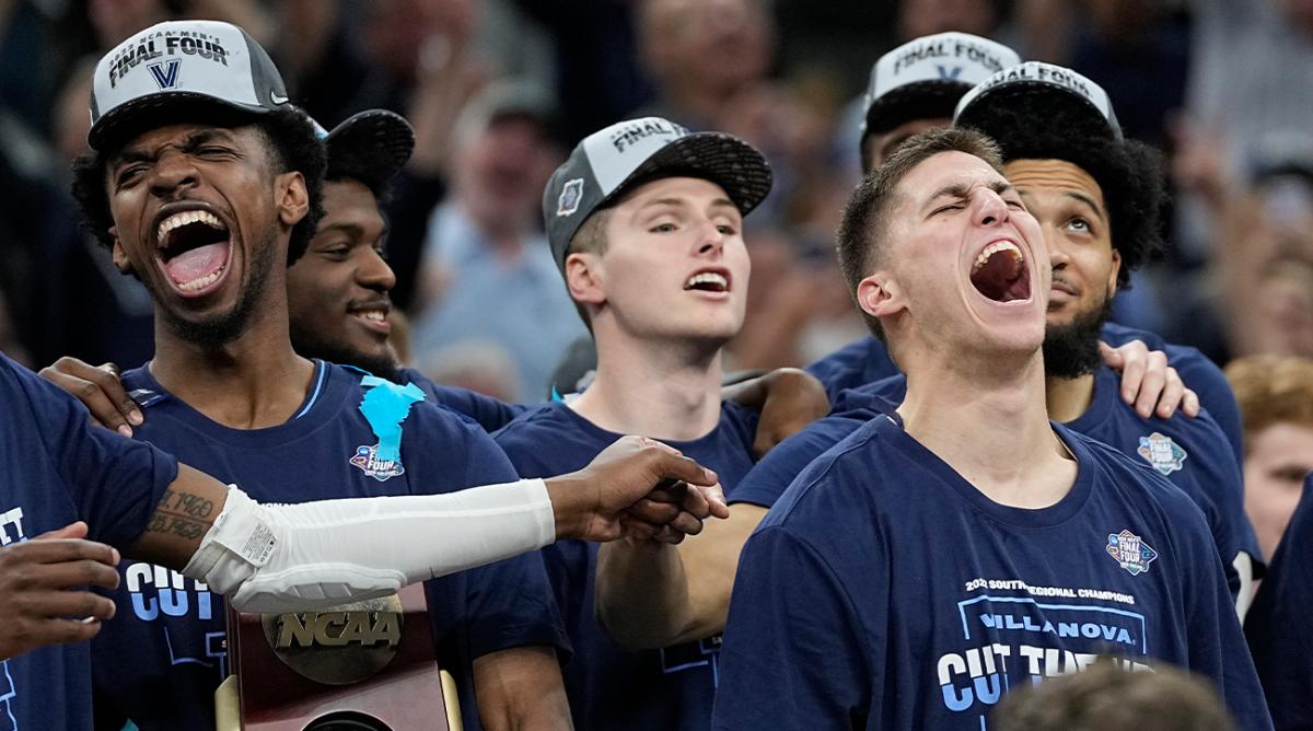 Villanova guard Collin Gillespie, right, celebrates after their win against Houston during a college basketball game in the Elite Eight round of the NCAA tournament on Saturday, March 26, 2022, in San Antonio.