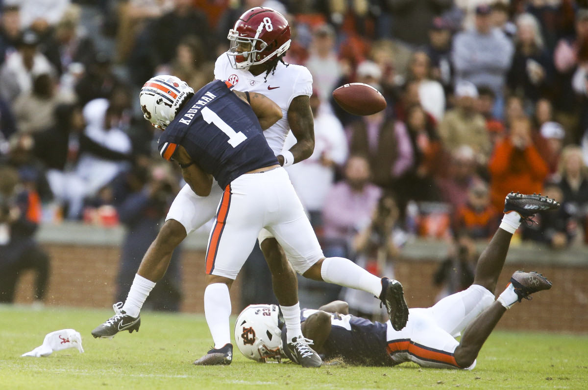 Nov 27, 2021; Auburn, Alabama, USA; Auburn Tigers Tigers safety Donovan Kaufman (1) breaks up a pass intended for Alabama Crimson Tide wide receiver John Metchie III (8) during the first half at Jordan-Hare Stadium. Mandatory Credit: Gary Cosby Jr.-USA TODAY Sports