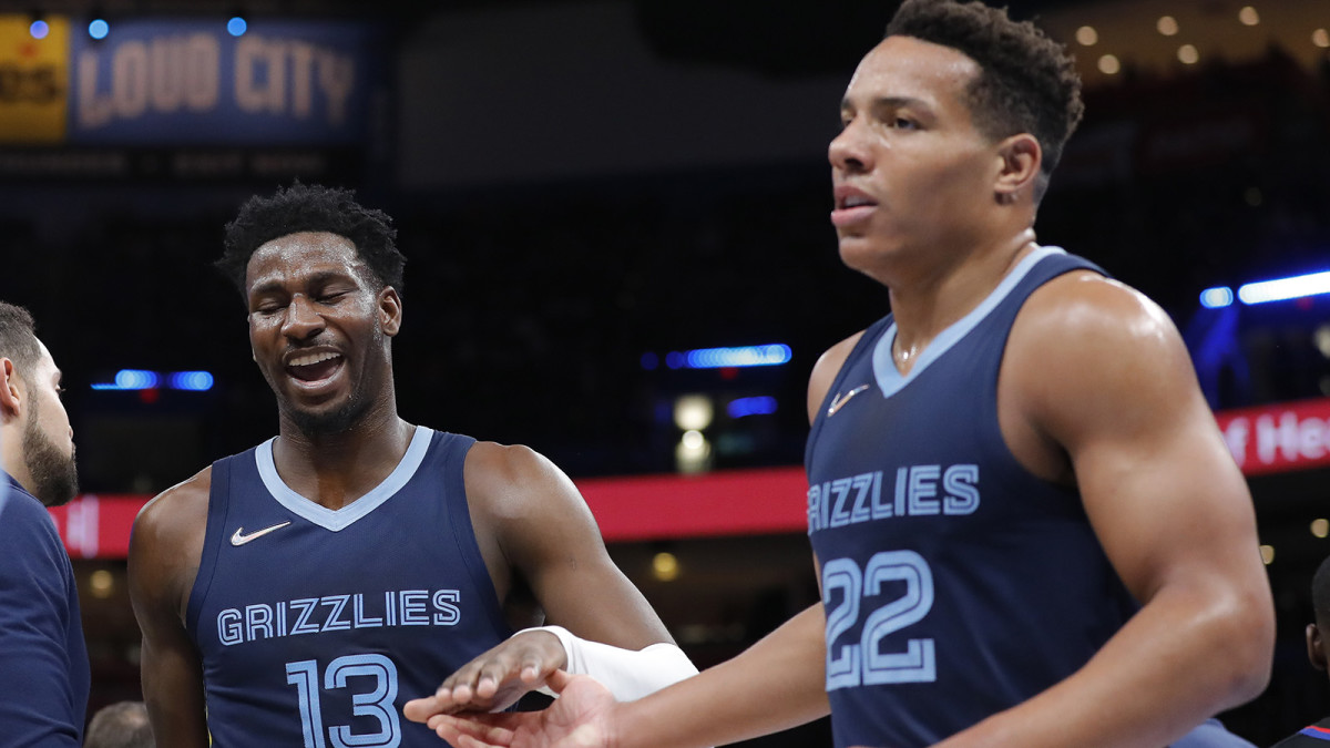 Memphis Grizzlies forward Jaren Jackson Jr. (13) and guard Desmond Bane (22) celebrate during a time out against the Oklahoma City Thunder.