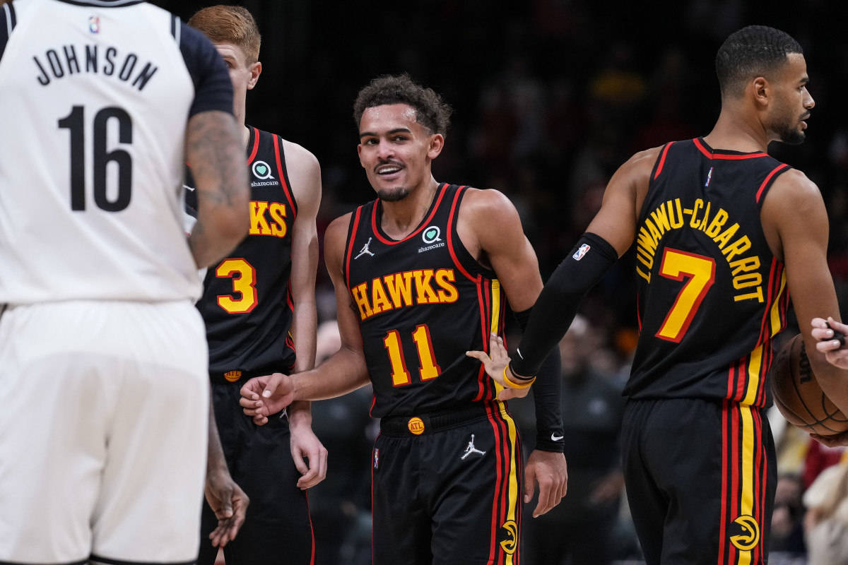 Dec 10, 2021; Atlanta, Georgia, USA; Atlanta Hawks guard Trae Young (11) reacts after an altercation with Brooklyn Nets forward Kevin Durant (7) (not shown) during the second half at State Farm Arena.