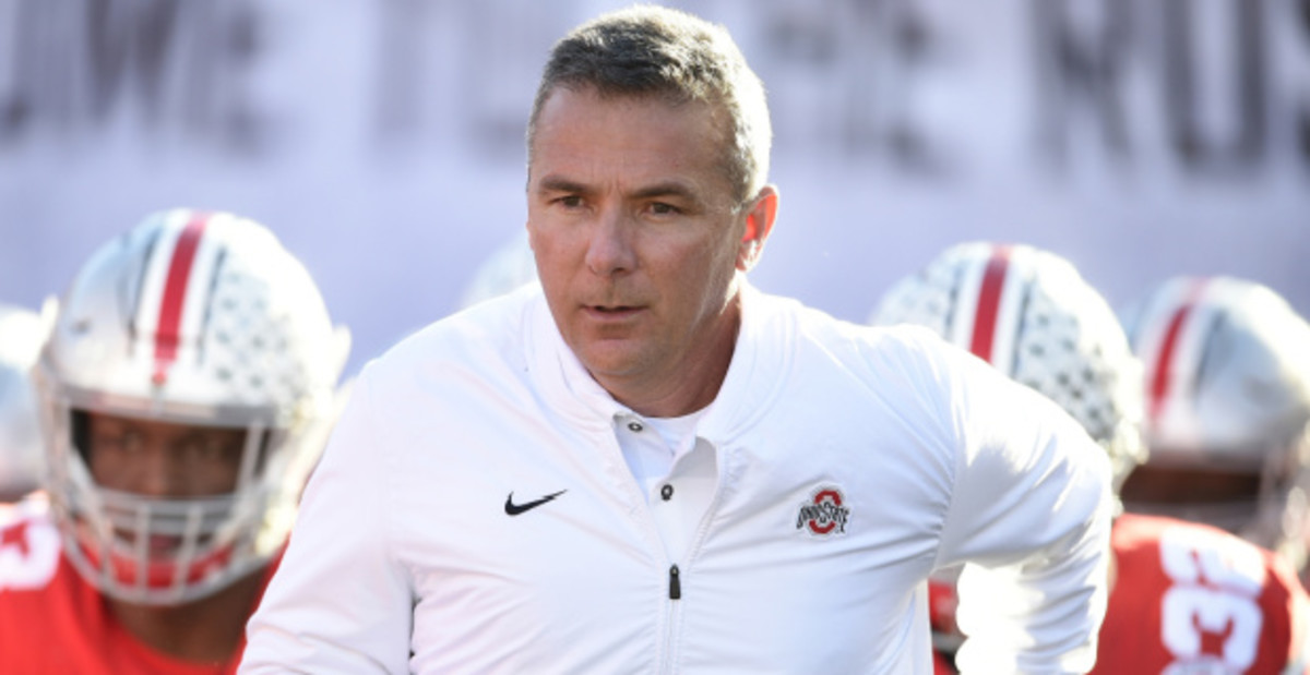 Ohio State Buckeyes head coach Urban Meyer runs out with his team prior to the Rose Bowl during the college football season.