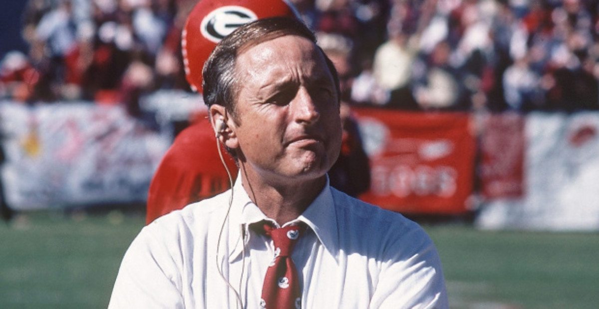 Georgia Bulldogs coach Vince Dooley standing on the sideline during a college football game in the SEC.