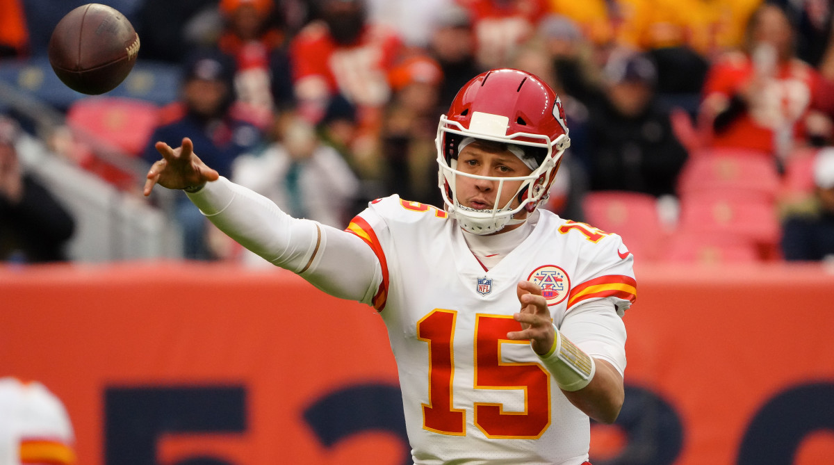 Kansas City Chiefs quarterback Patrick Mahomes (15) attempts a pass in the first quarter against the Denver Broncos at Empower Field at Mile High.