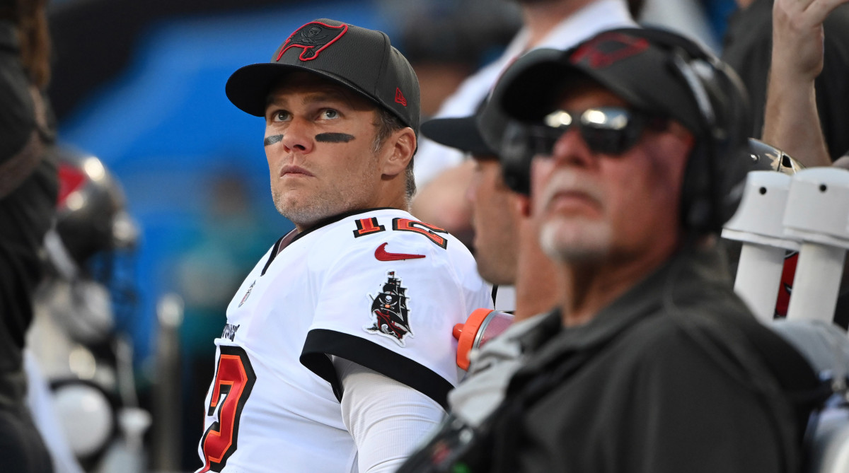 Tampa Bay Buccaneers quarterback Tom Brady (12) and head coach Bruce Arians on the bench in the fourth quarter at Bank of America Stadium.