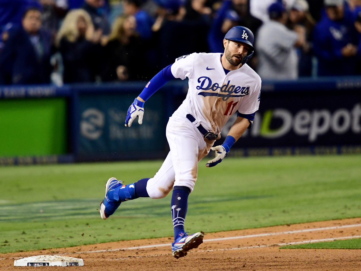 Oct 21, 2021; Los Angeles, California, USA; Los Angeles Dodgers left fielder AJ Pollock (11) runs after hitting a three run home run in the eighth inning against the Atlanta Braves during game five of the 2021 NLCS at Dodger Stadium.