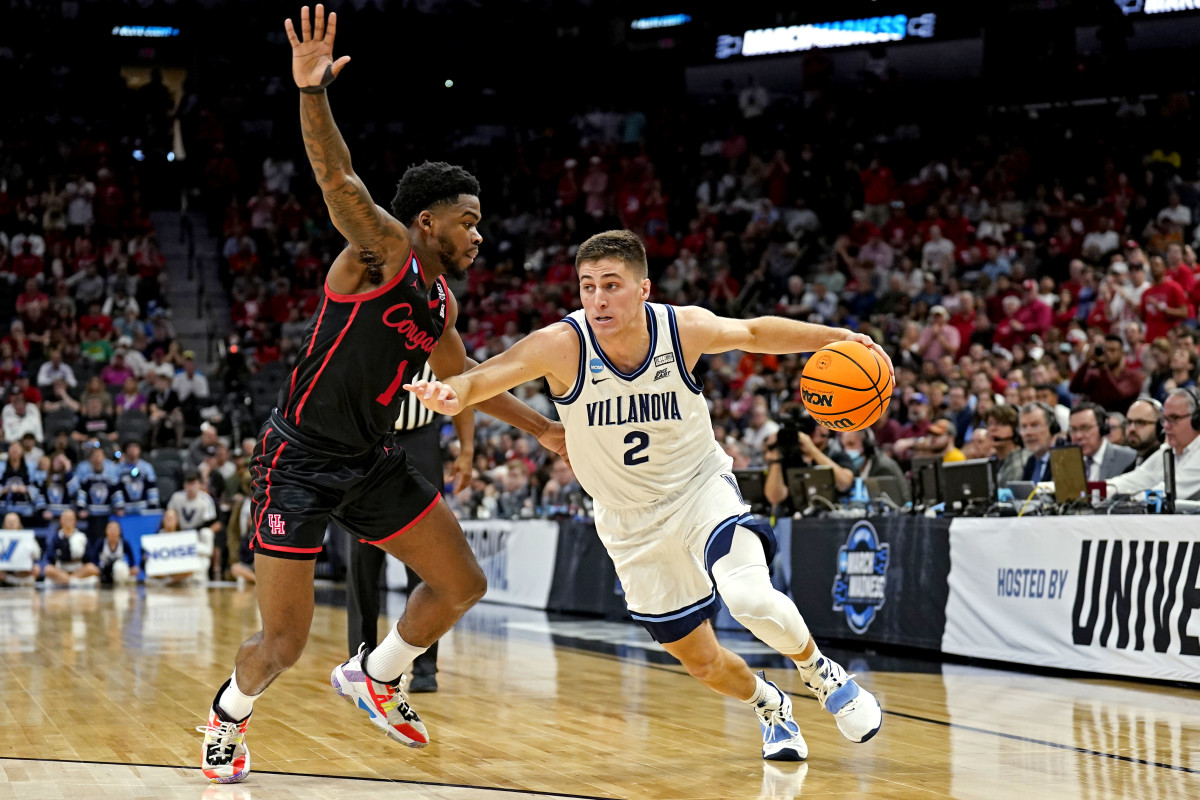 Mar 26, 2022; San Antonio, TX, USA; Villanova Wildcats guard Collin Gillespie (2) drives to the basket against Houston Cougars guard Jamal Shead (1) during the first half in the finals of the South regional of the men's college basketball NCAA Tournament at AT&T Center. Mandatory Credit: Scott Wachter-USA TODAY Sports