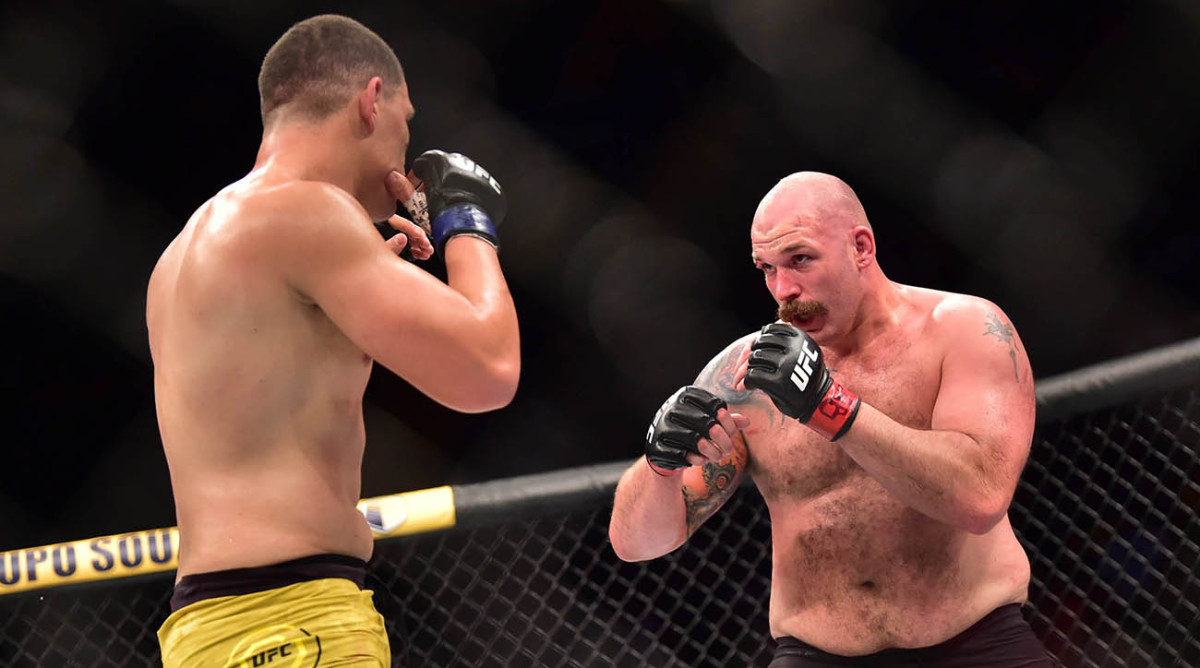 Timothy Johnson (red gloves) fights Marcelo Golm (blue gloves) during UFC Fight Night at Mangueirinho Arena.