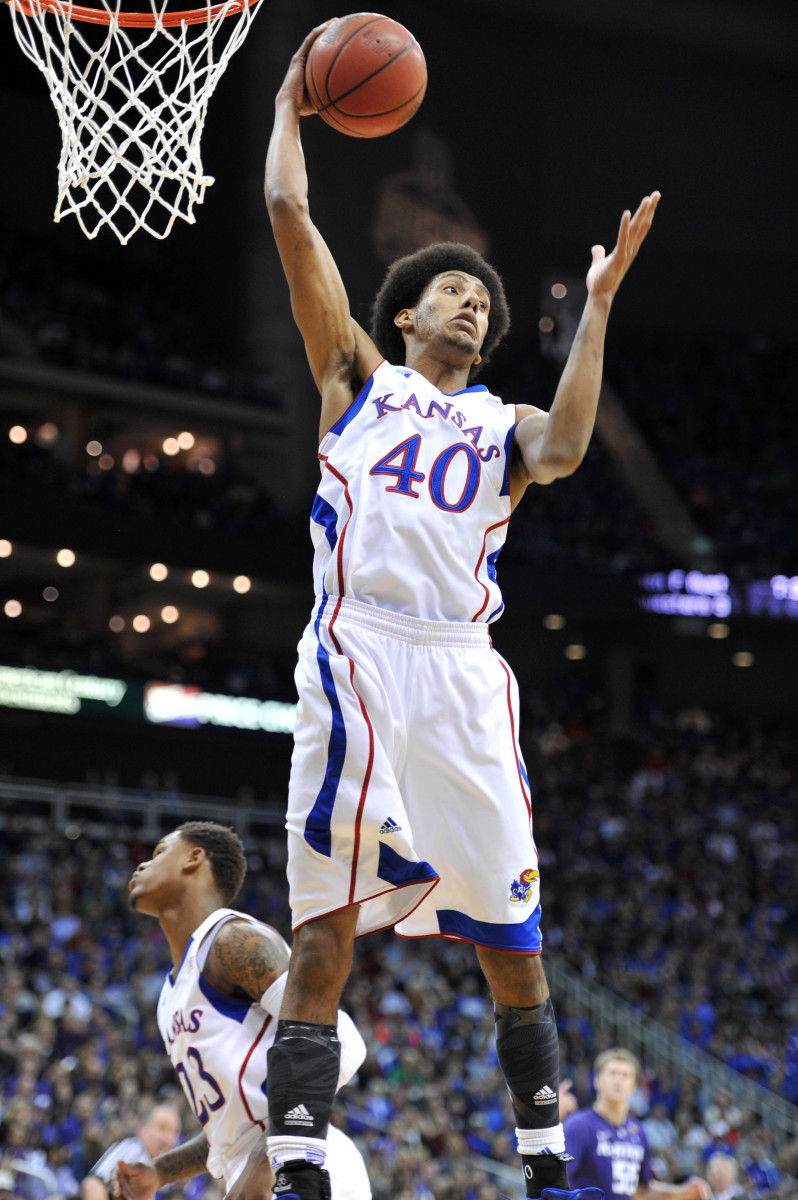 Mar 16, 2013; Kansas City, MO, USA; Kansas Jayhawks forward Kevin Young (40) grabs a defensive rebound against the Kansas State Wildcats in the first half during the championship game of the Big 12 tournament at the Sprint Center. Mandatory Credit: Peter G. Aiken-USA TODAY Sports