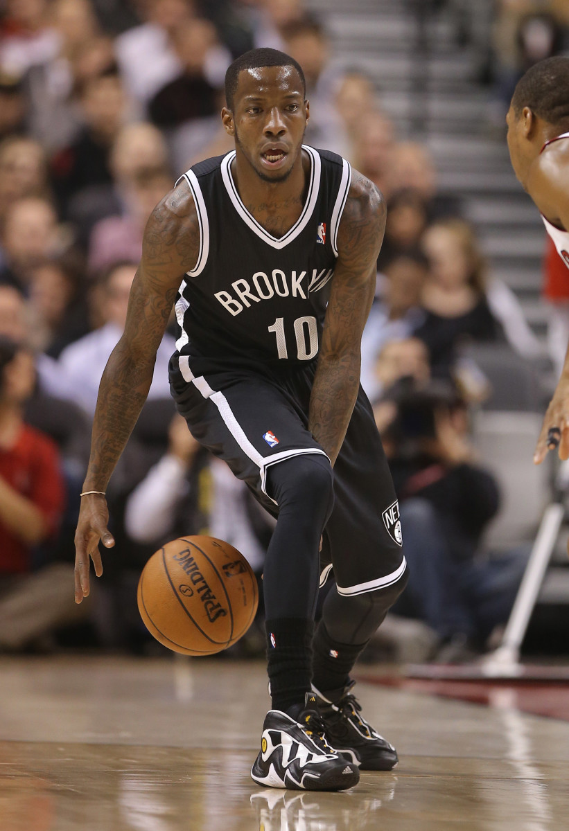 Nov 26, 2013; Toronto, Ontario, CAN; Brooklyn Nets point guard Tyshawn Taylor (10) with the ball against the Toronto Raptors at Air Canada Centre. The Nets beat the Raptors 102-100. Mandatory Credit: Tom Szczerbowski-USA TODAY Sports