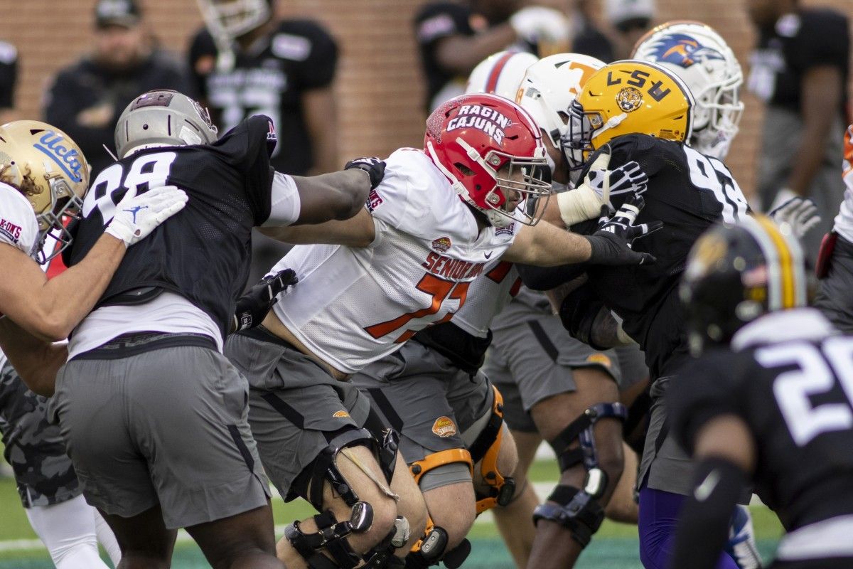 American offensive lineman Braxton Jones of Southern Utah (77) blocks rushers on the line during American practice for the 2022 Senior Bowl at Hancock Whitney Stadium.